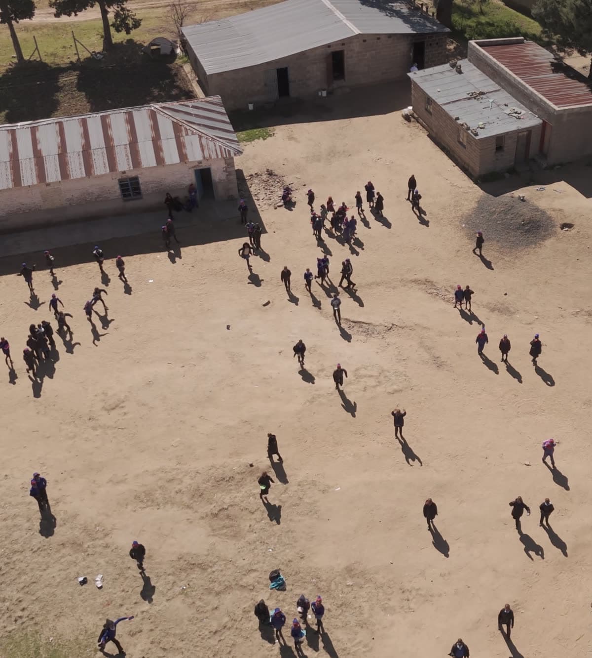 Learners in a school yard in Lesotho, seen from above